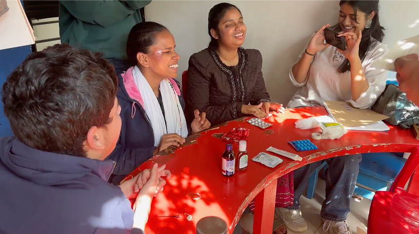 Observing caregivers discuss medicine routines around a table